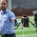 A robot by the Michigan Autonomous Aerial Vehicles Team flies just above the field during Michigan Robotics Day at the Jack Roth Stadium Club at Michigan Stadium on Monday, April 15, 2013. Melanie Maxwell I AnnArbor.com